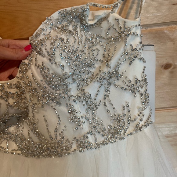 Elegant White Wedding Dress with Silver Embellishments - Picture 3 of 11